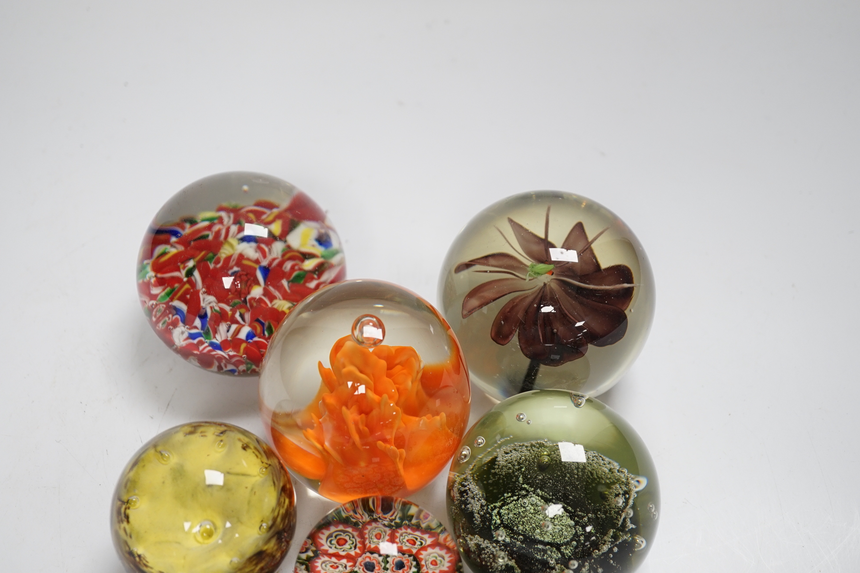 Eight Scottish or Chinese glass paperweights